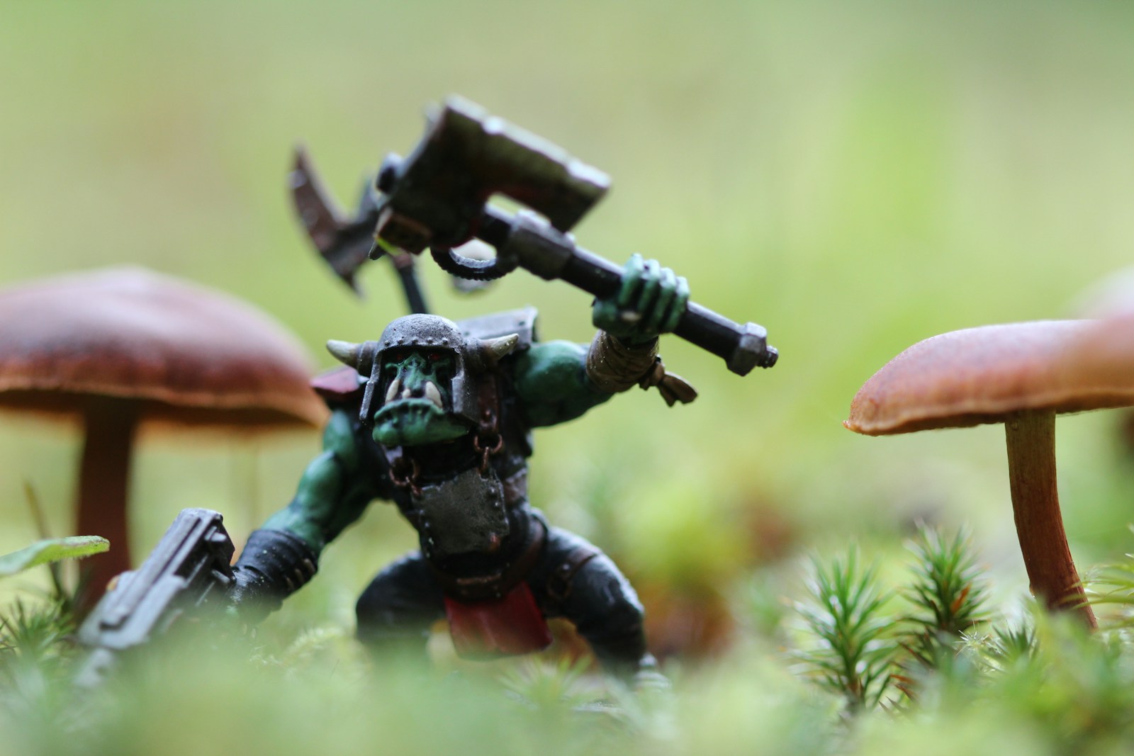 closeup photography of monster with axe action figure