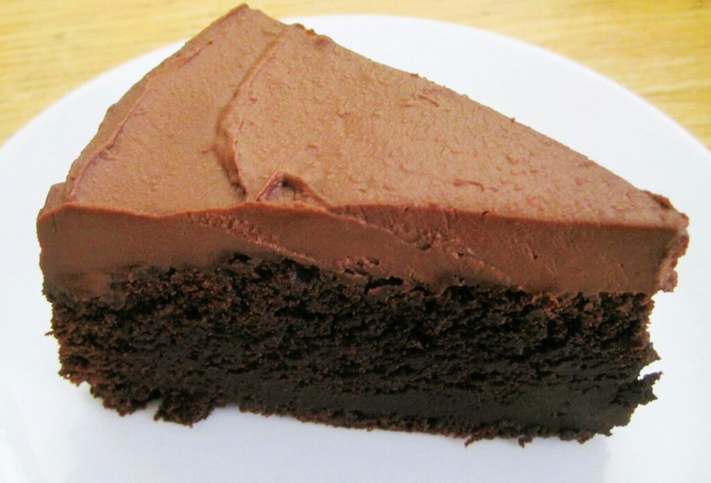 A slice of chocolate cake with frosting